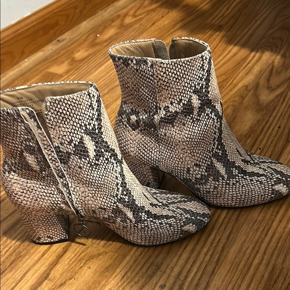Able Cream and Black Ankle Booties with Modern Silhouette